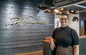Photo of Chris Casey standing at her business.