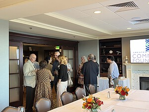 Photo of people socializing at the Philanthropy Roundtable event.